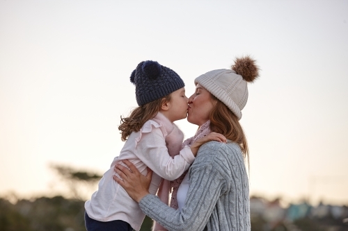 Mother and daughter sharing special moments together in winter - Australian Stock Image