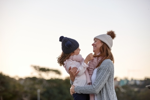 Mother and daughter sharing special moments together in winter - Australian Stock Image