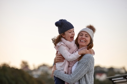 Mother and daughter sharing special moments together in winter - Australian Stock Image