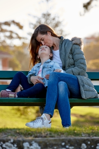 Mother and daughter together at park - Australian Stock Image