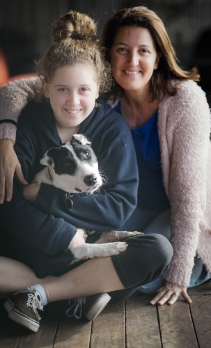 Mother and daughter with puppy - Australian Stock Image