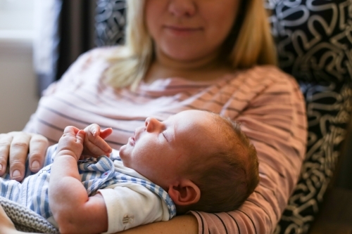 Mother nursing new born baby - Australian Stock Image
