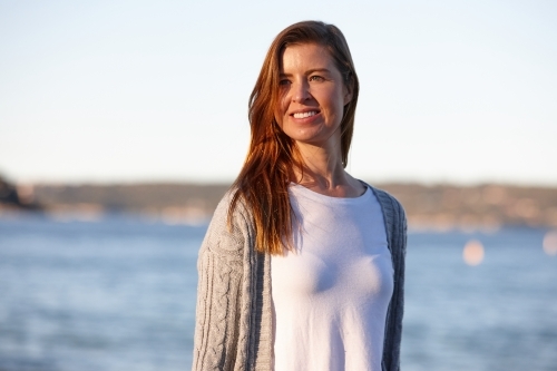 Mother relaxing outdoors at beachside - Australian Stock Image