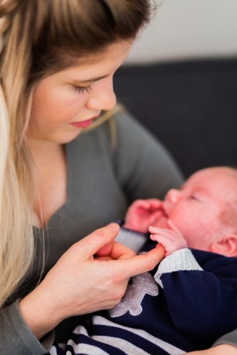 Mother with baby boy little fingers and hands - Australian Stock Image