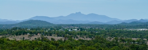 Mount Larcom in hazy light - Australian Stock Image