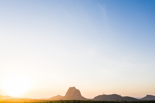 Mount Tibrogragan and the Glasshouse Mountains at Sunset - Australian Stock Image