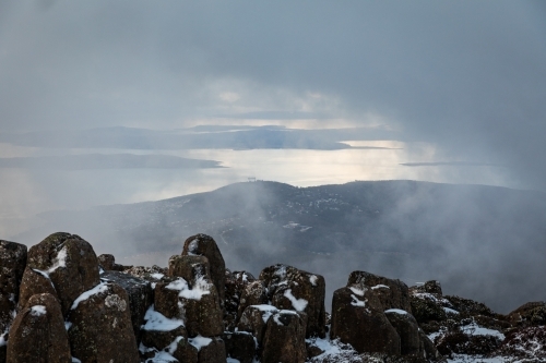mountain landscape with rocks and snow - Australian Stock Image