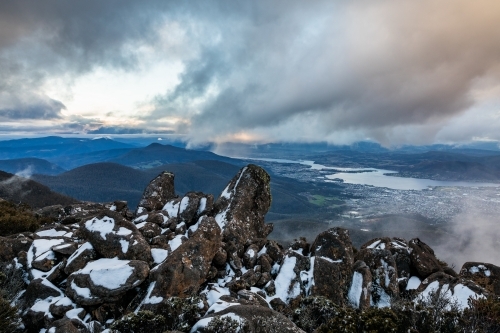 mountain landscape with rocks and snow - Australian Stock Image