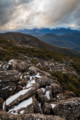 mountain landscape with rocks and snow - Australian Stock Image