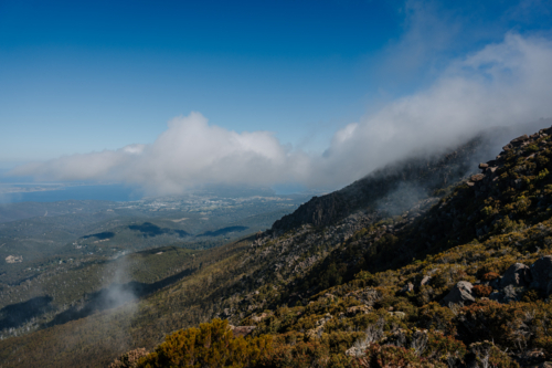 Mountainous terrain covered with soft veil of clouds - Australian Stock Image