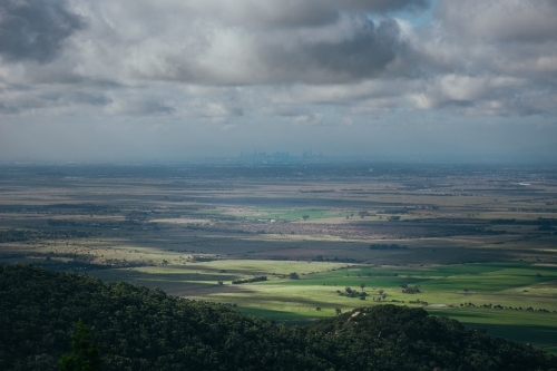 Mountains, Paddocks, and the Melbourne Skyline. - Australian Stock Image