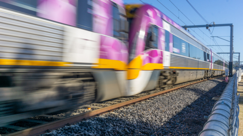 Moving commuter train in outer Melbourne, St Albans - Australian Stock Image