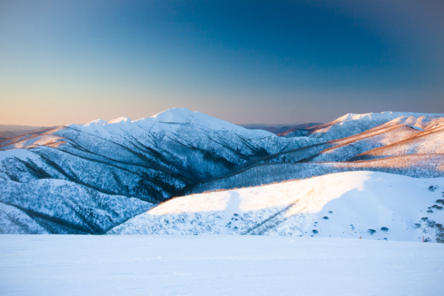 Mt Feathertop and surrounding landscape at sunset during winter near Mt Hotham in Victoria - Australian Stock Image
