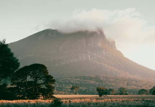 Mt Sturgeon under winter clouds. - Australian Stock Image