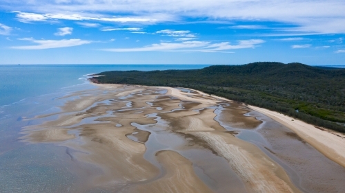 multicolour patterns at low tide on sands flats at The Point near Bird Island, Queensland - Australian Stock Image