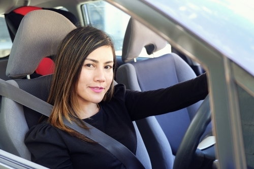 Multicultural Asian woman in the car - Australian Stock Image
