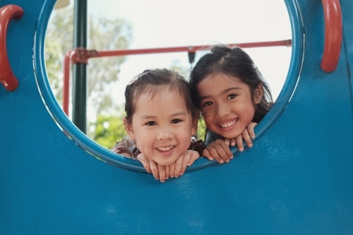 multicultural kids having fun at playground - Australian Stock Image