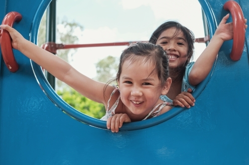 multicultural kids having fun at playground - Australian Stock Image