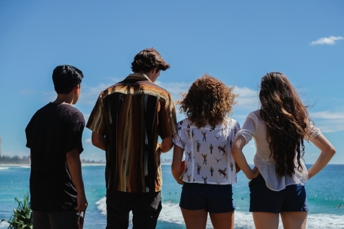 multicultural teenagers hang out near the beach - Australian Stock Image