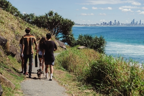 Multicultural teenagers walking near the beach - Australian Stock Image