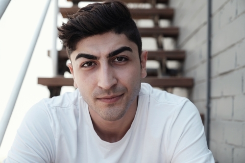multicultural young adult man, university student - Australian Stock Image