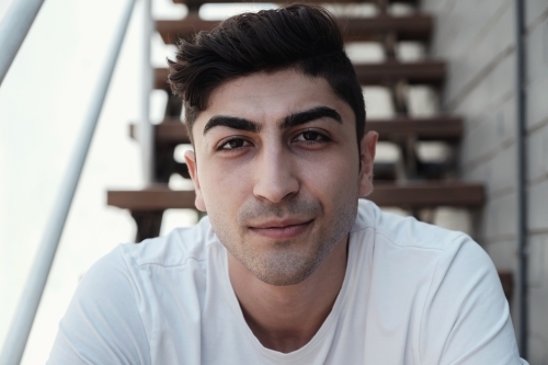 Multicultural young adult man, university student - Australian Stock Image