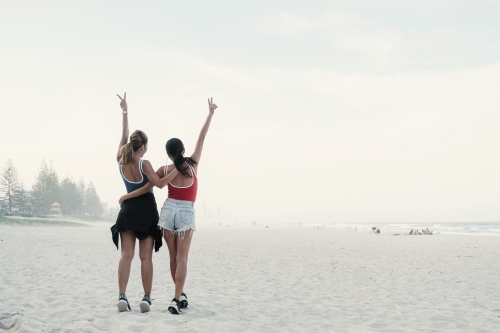 Multicultural young adult women on the beach - Australian Stock Image