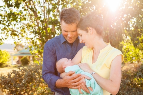 Mum and dad with their newborn daughter - Australian Stock Image