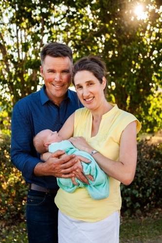 Mum and dad with their newborn daughter - Australian Stock Image