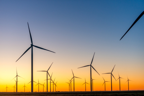 Murra Warra Wind Farm with turbines silhouetted at dusk - Australian Stock Image
