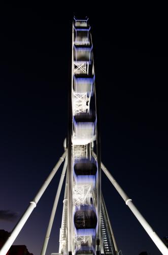 Narrow view of Brisbane Wheel lit up at night with movement blur - Australian Stock Image