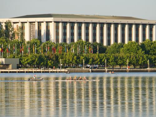 National Library, Canberra, reflected in Lake Burley Griffin with rowers