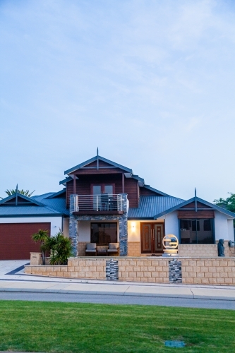 Neat home in coastal suburb at dusk Iluka, Western Australia - Australian Stock Image