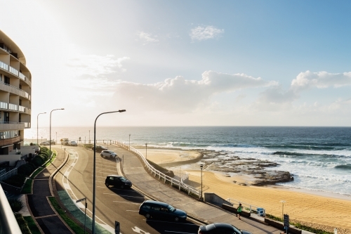 Newcastle beach at sunrise from a balcony - Australian Stock Image