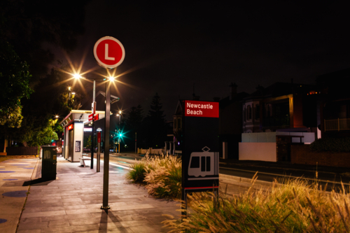 Newcastle Beach Light Rail public transport station at night - Australian Stock Image
