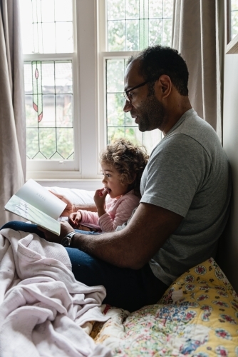 Daddy and little girl story time