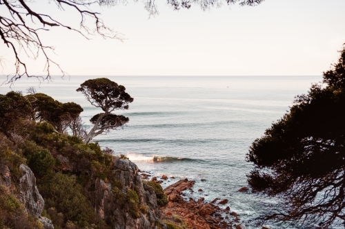 Ocean view of rugged coastline at sunset - Australian Stock Image