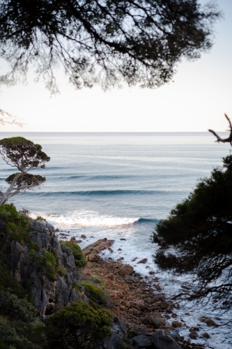 Ocean view of rugged coastline at sunset - Australian Stock Image