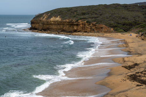ocean water sand and cliff at Bells Beach - Australian Stock Image
