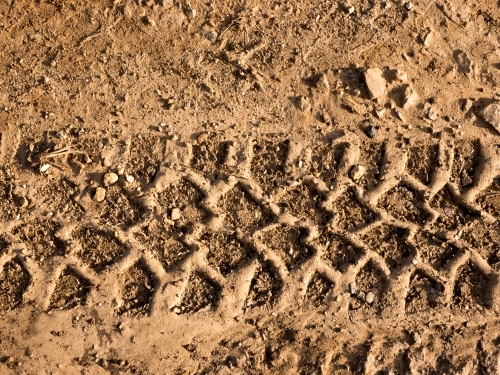 Off road tyre pattern in brown soil
