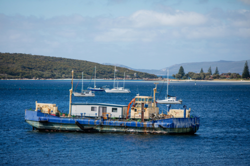 Old barge covered in rust - Australian Stock Image