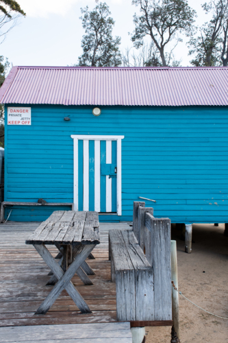 Old blue cafe in fishing hut at Merimbula, New South Wales - Australian Stock Image