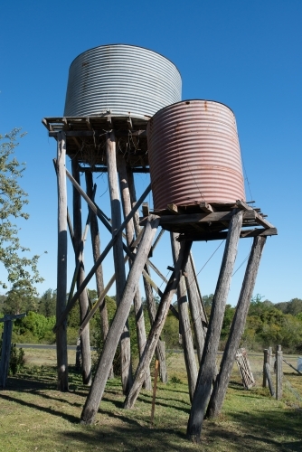 Old farm water tanks leaning - Australian Stock Image
