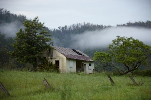 Old homestead in rural landscape