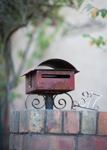 Old letterbox and house number - Australian Stock Image