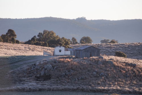 Old shed on a hill early one winter's morning - Australian Stock Image