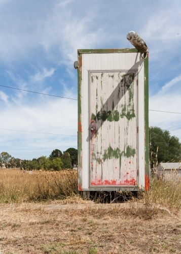 Old toilet at an abandoned petrol station