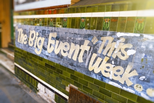 Old vintage sign on wall of pub - Australian Stock Image
