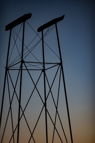 Old water tank stand at twilight - Australian Stock Image