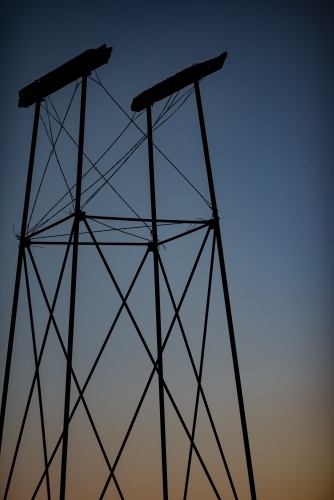 Old water tank stand at twilight
